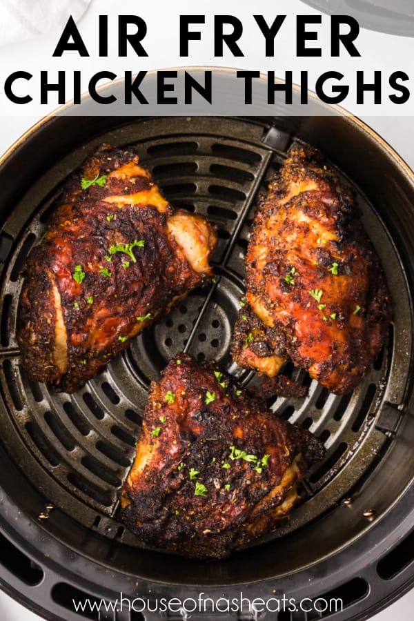 Three cooked chicken thighs in the basket of an air fryer with text overlay.