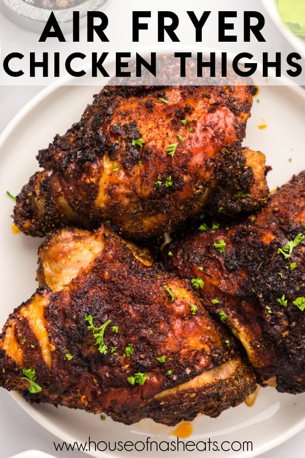 An image of air fryer chicken thighs on a white plate with text overlay.