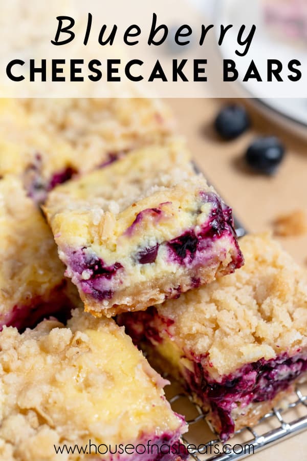 Stacked blueberry cheesecake bars with text overlay.