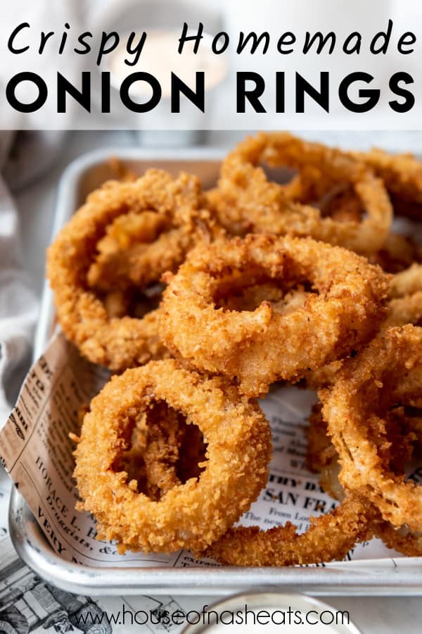 Crispy onion rings in a pile with text overlay.
