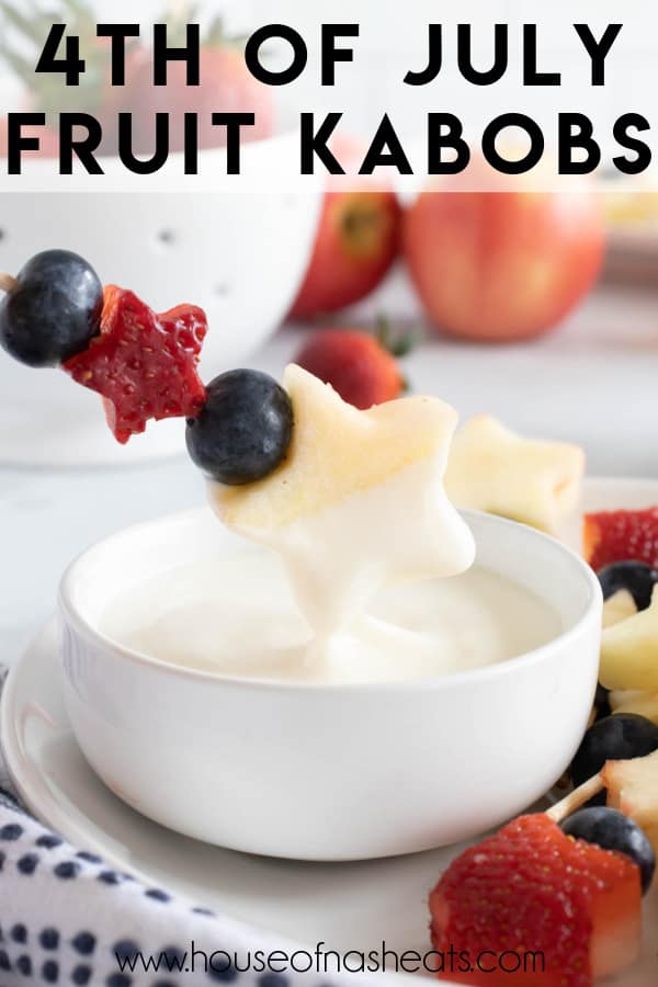 A patriotic fruit kabob being dipped in yogurt fruit dip with text overlay.