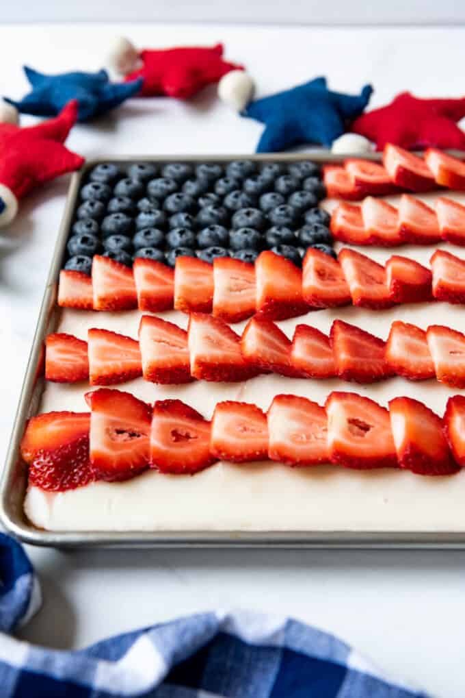 A side angle of a 4th of July flag cake made with fresh fruit.