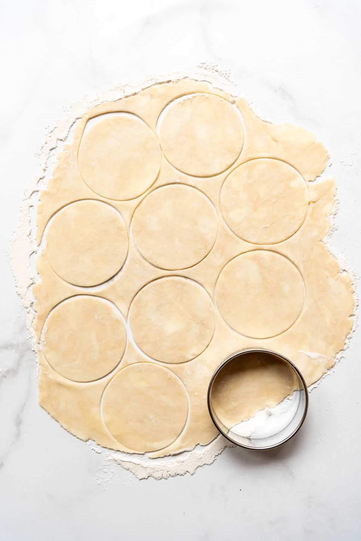 Cutting out circles of pie crust.