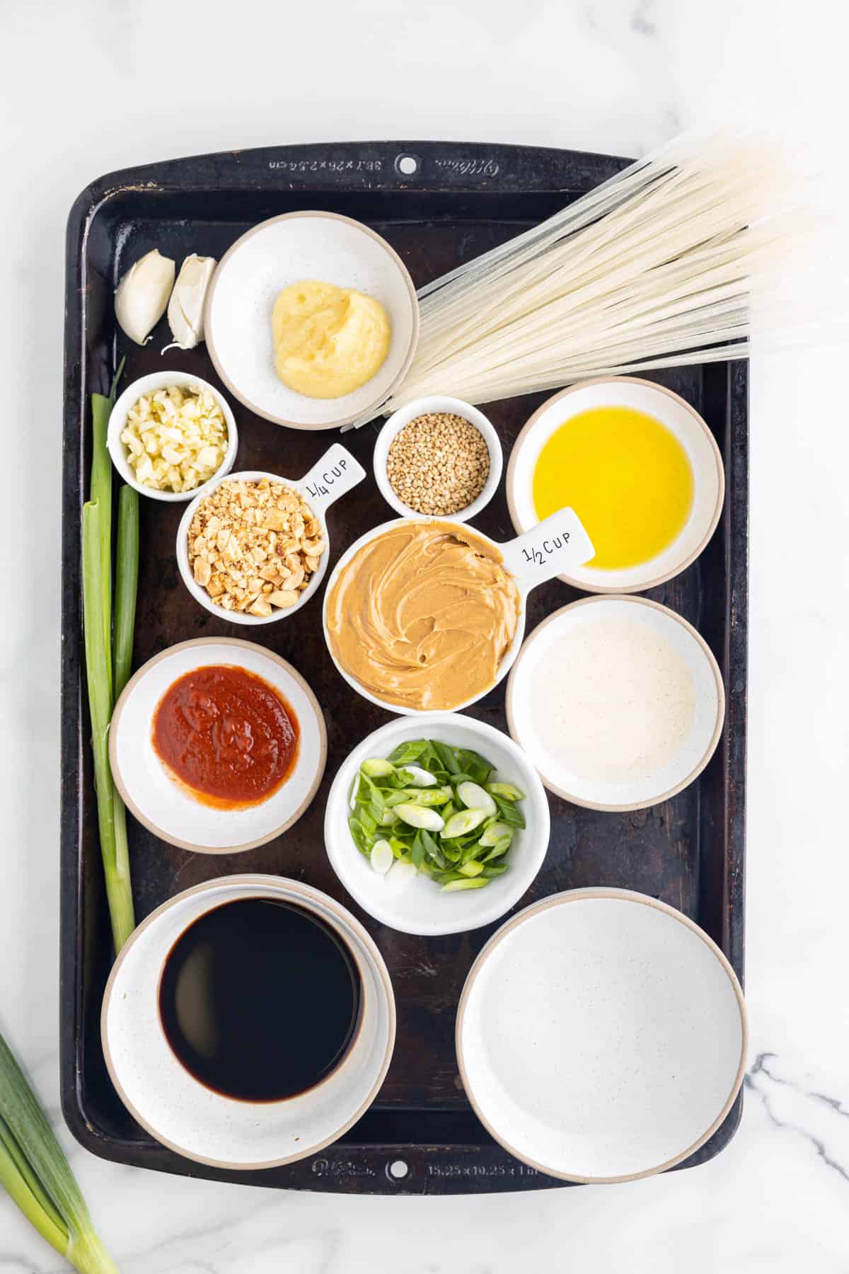 Top view of ingredients needed to make peanut sauce noodles.
