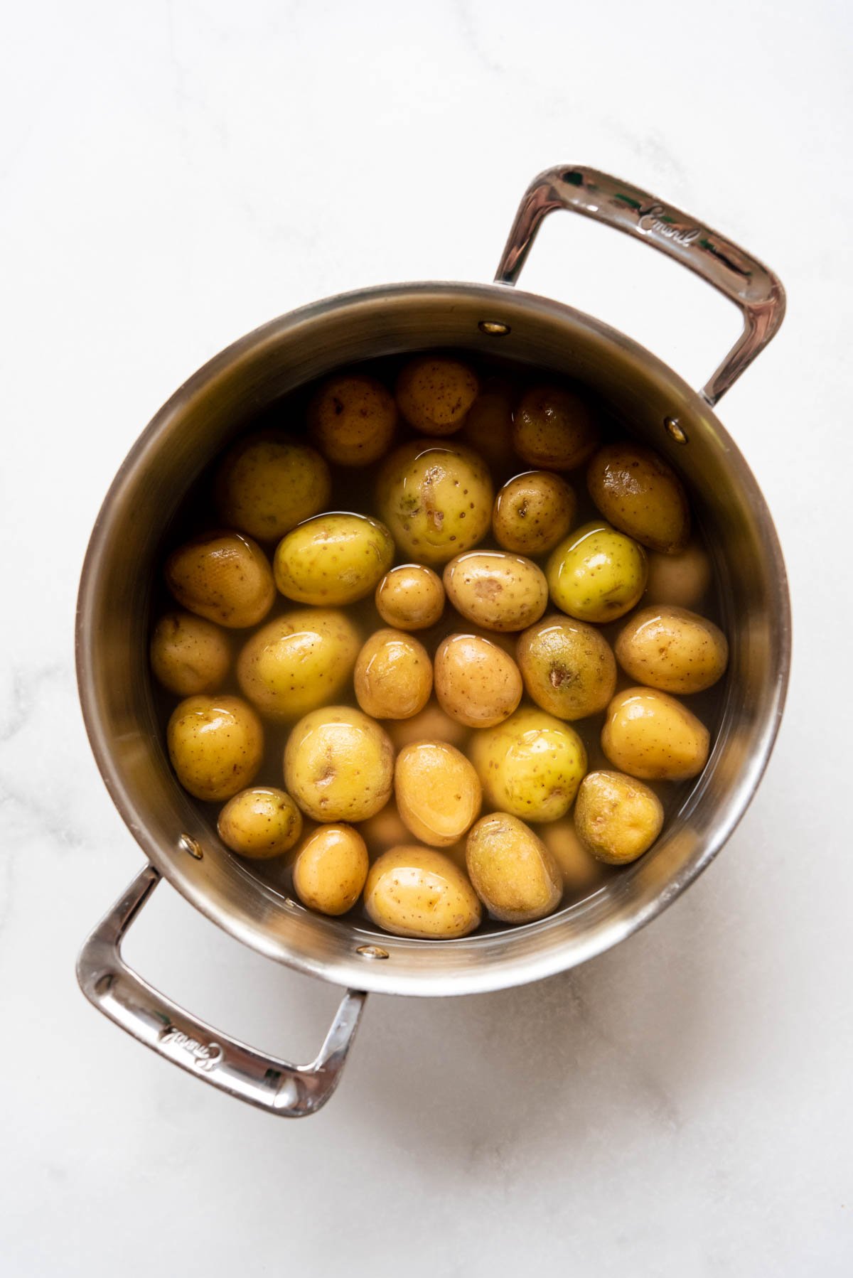 Small potatoes in a large pot of salted water.