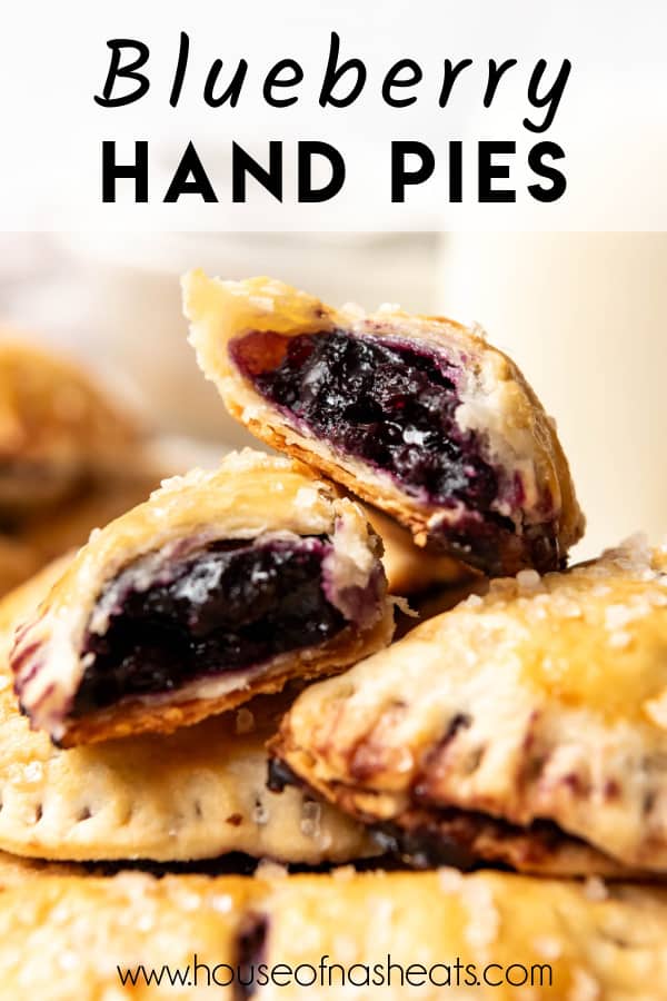 Stacked blueberry hand pies with one torn in half with text overlay.