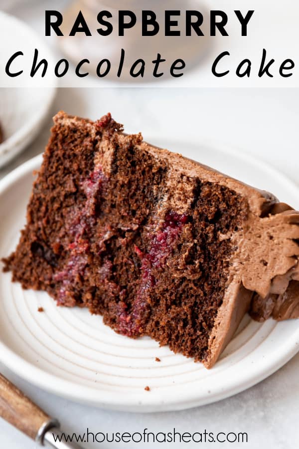 A slice of raspberry chocolate cake on a plate with text overlay.