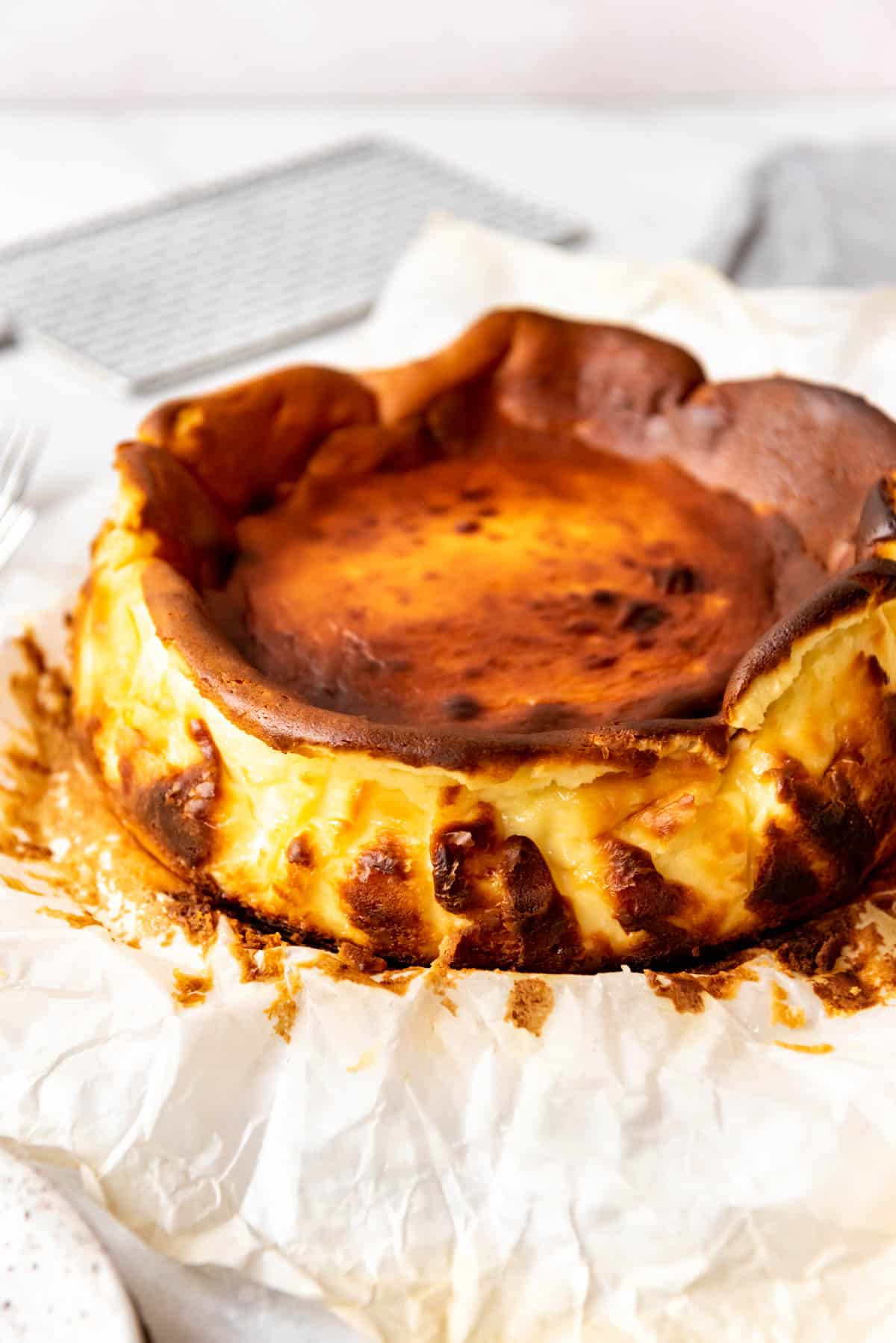 An unwrapped basque cheesecake.