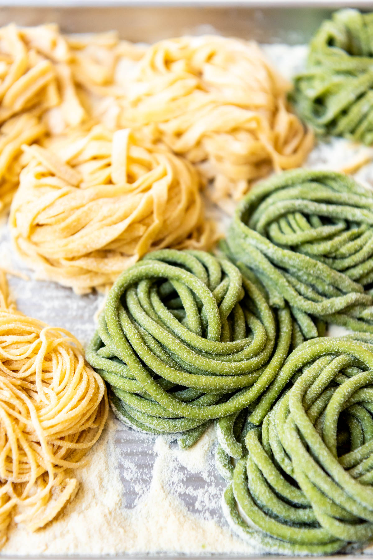 A close image of spinach bucatini pasta.