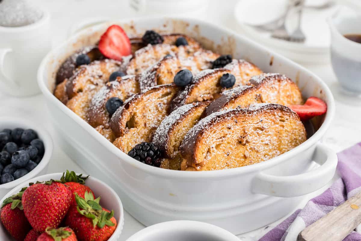 Overnight French toast in a white baking dish.