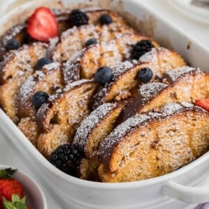 An image of baked overnight french toast in a white baking dish.