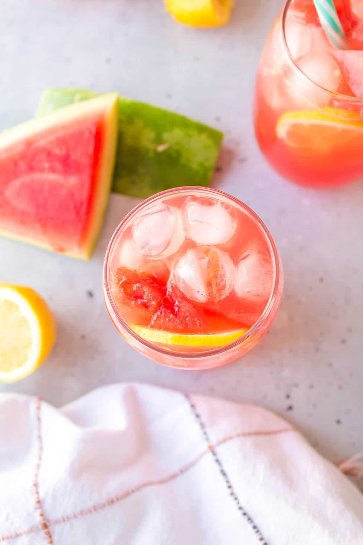 An overhead image of a glass of watermelon lemonade.