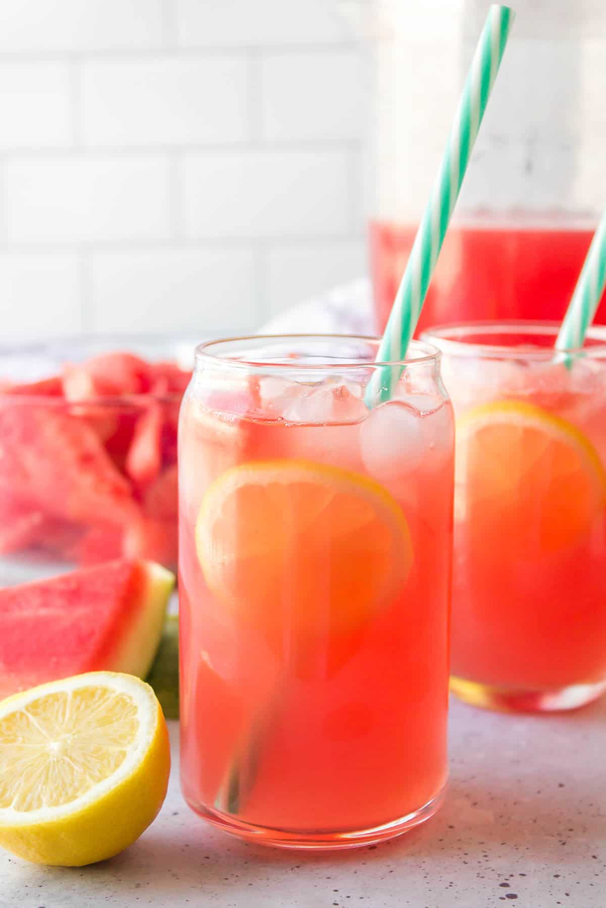 A tall glass of watermelon lemonade.