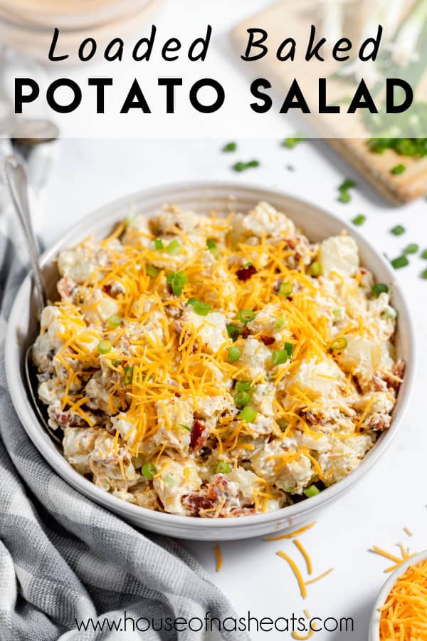 A bowl of loaded baked potato salad with text overlay.