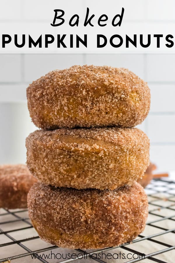 Three baked pumpkin donuts stacked in a tower with text overlay.