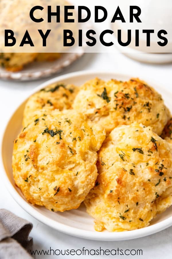 Homemade cheddar bay biscuits on a plate with text overlay.