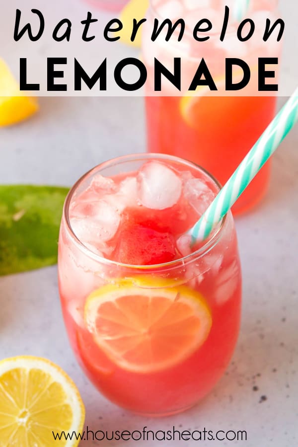A glass of watermelon lemonade with a straw in it garnished with chunks of watermelon and slices of fresh lemon with text overlay.