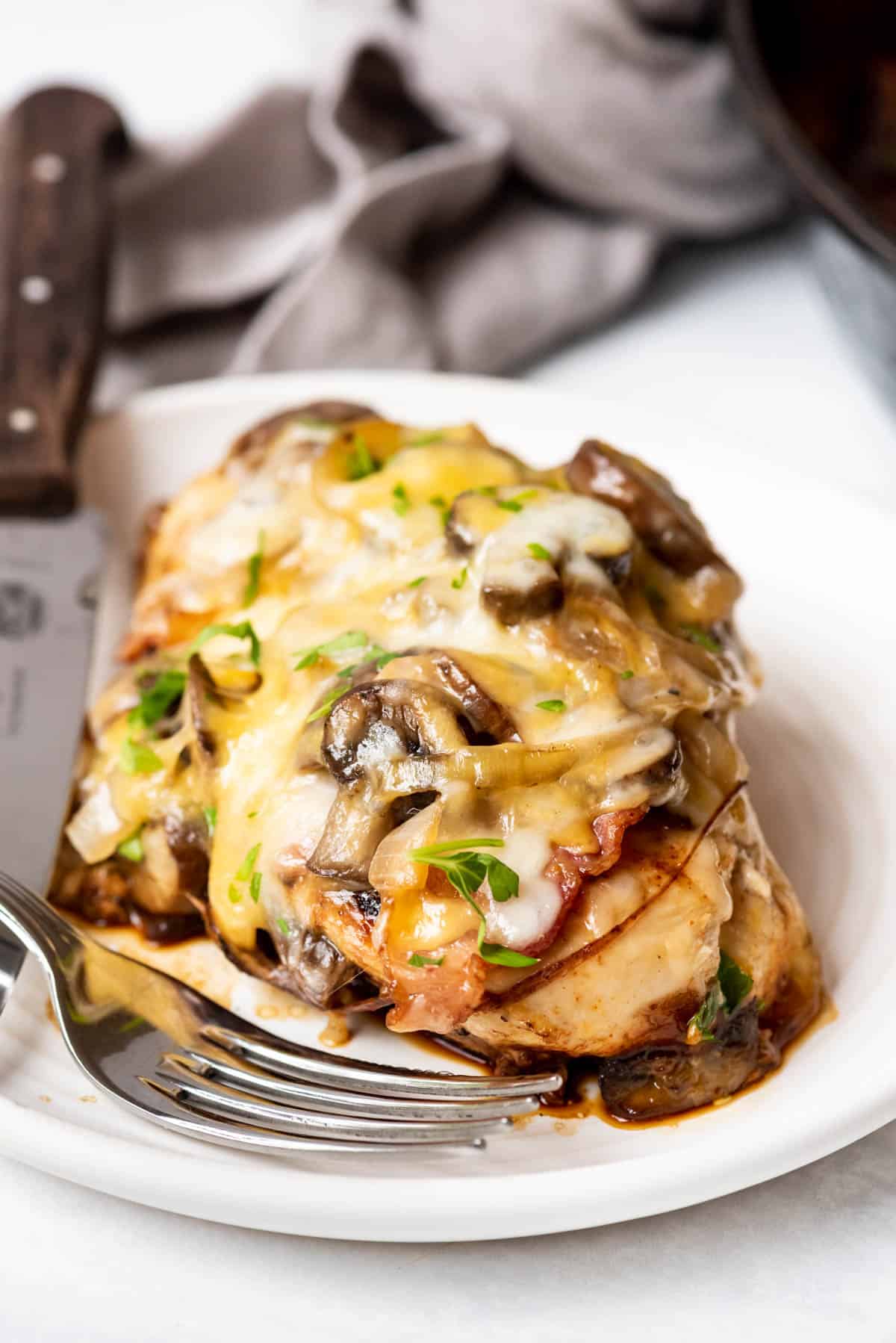Melted cheese and sauteed onions on a piece of moist chicken.