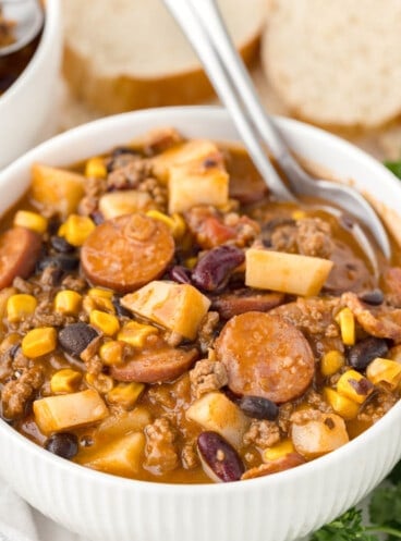 A spoon in a bowl of cowboy stew.