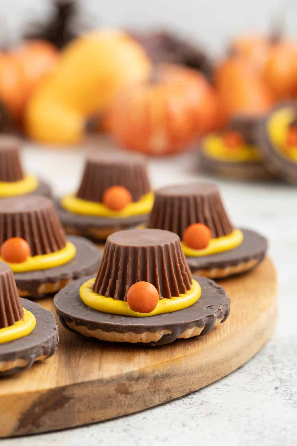 Pilgrim hat cookies made with Keebler Fudge Stripes cookies, Reese's Peanut Butter Cups, frosting and mini Reese's Pieces.