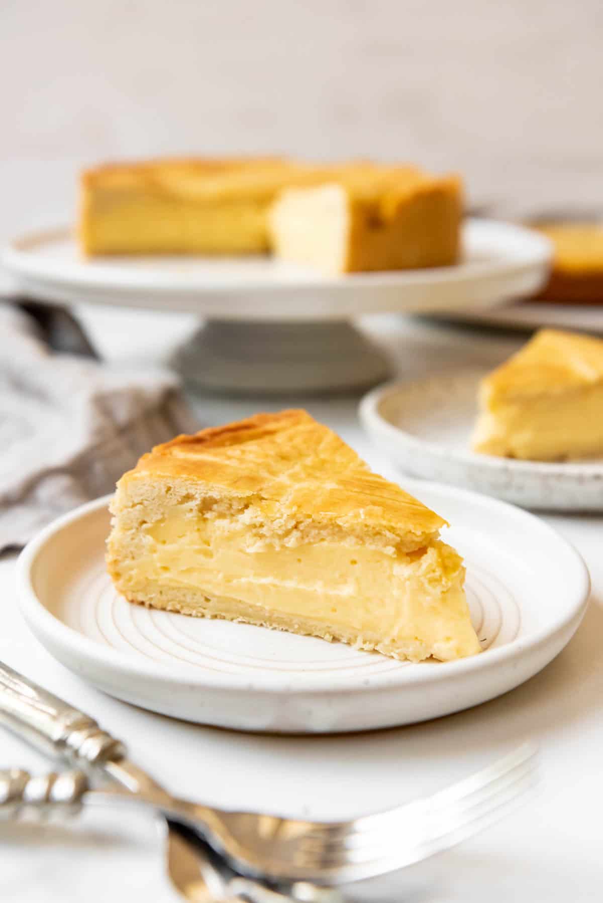 A slice of Gateau Basque cake on a plate.