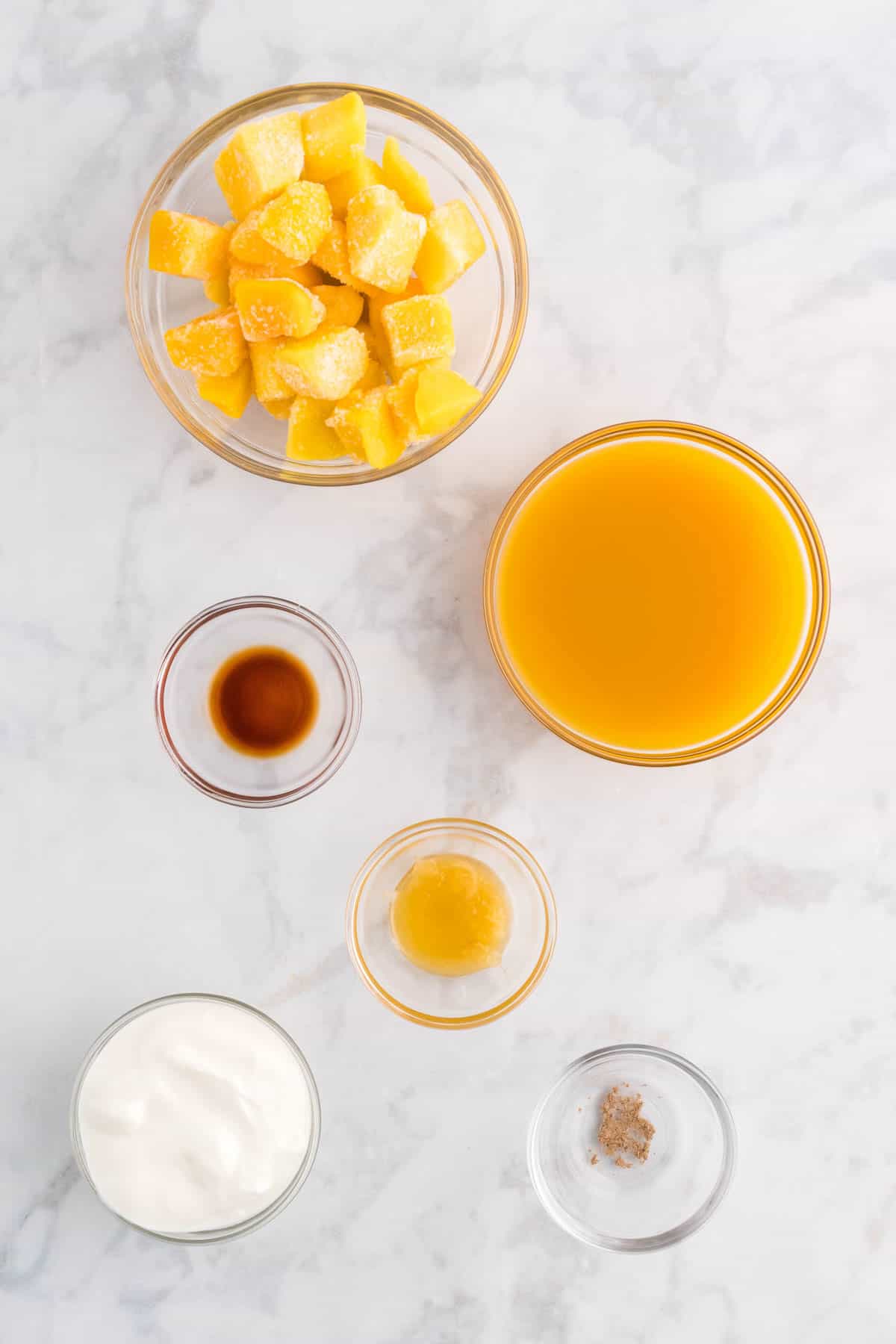 Ingredients for making mango lassi.