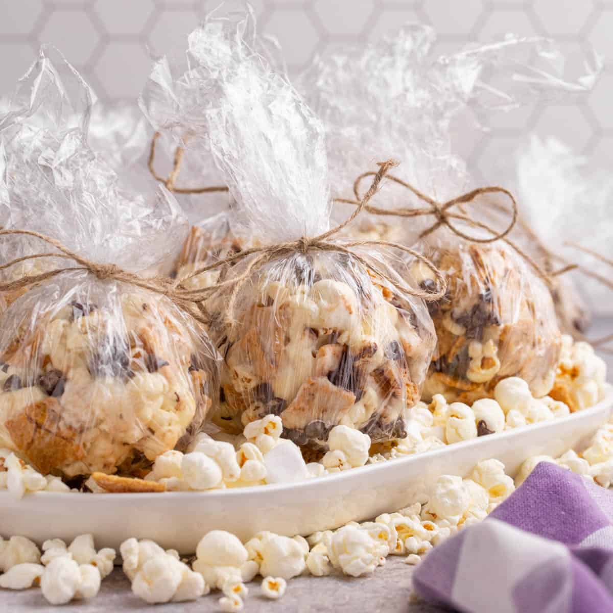 S'mores popcorn balls wrapped in cellophane.