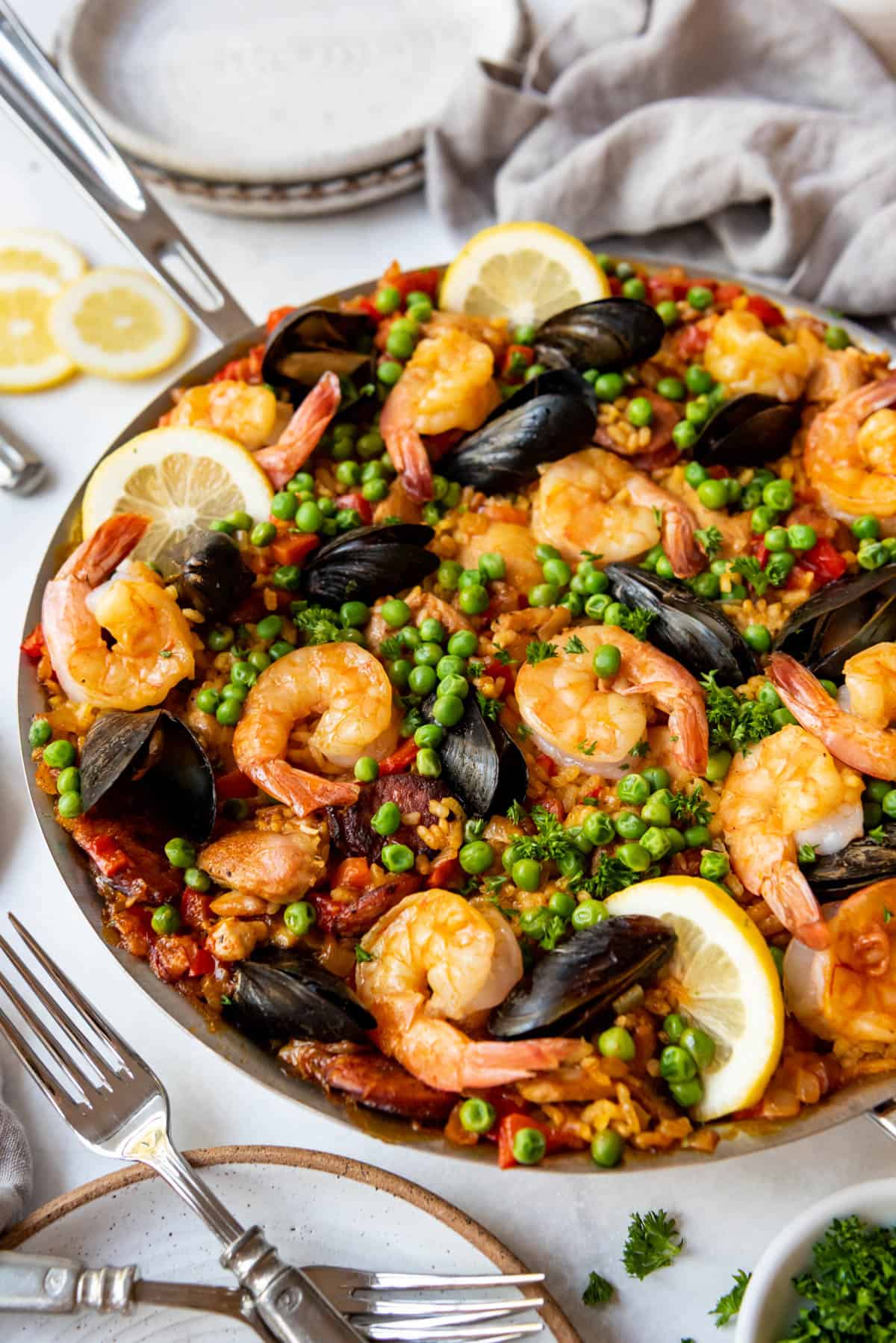 A large pan of Spanish paella with shrimp and mussels.