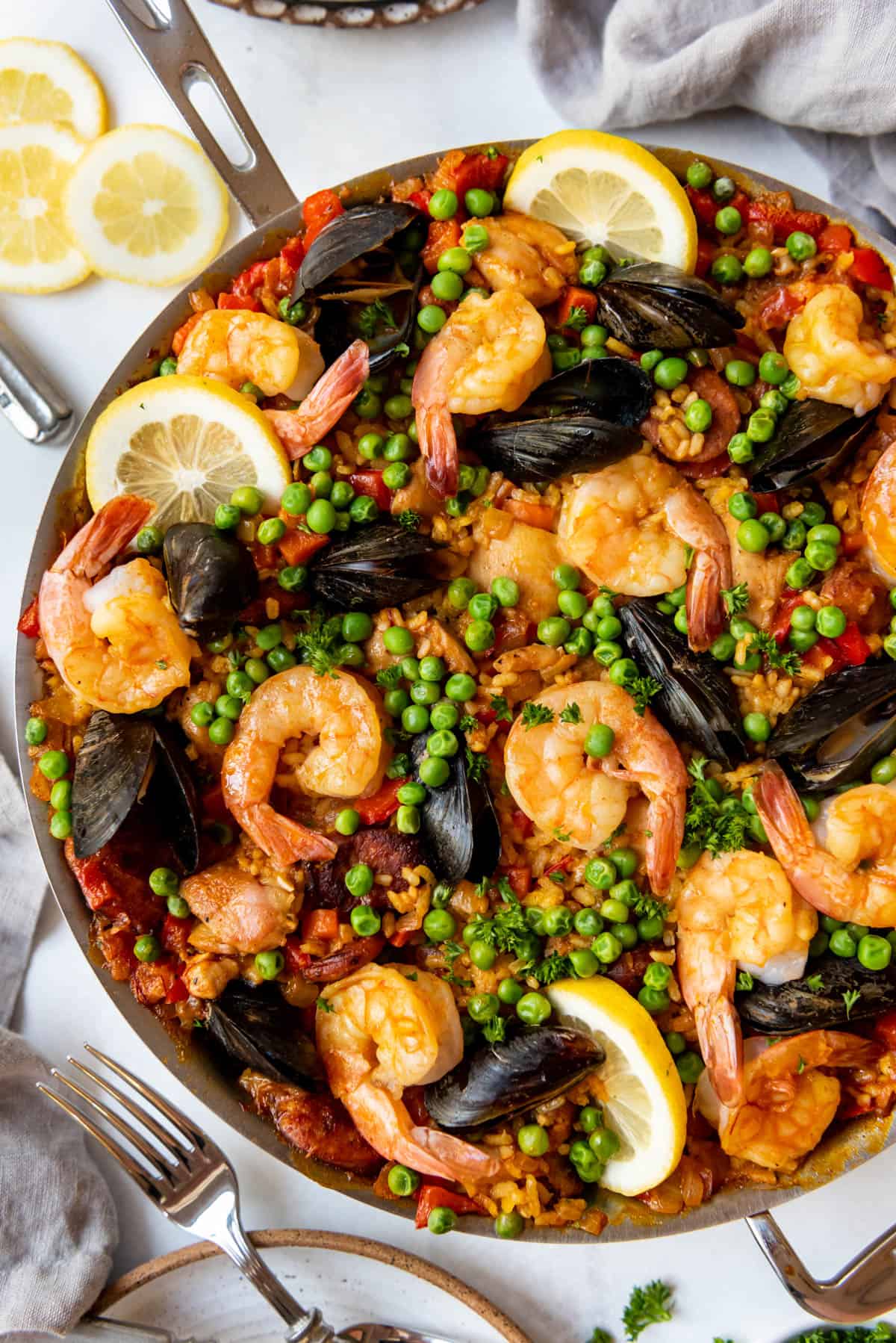 An overhead image of a large skillet of paella.