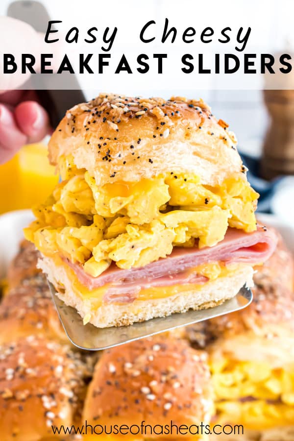 A breakfast slider with scrambled eggs, ham, and cheese on Hawaiian rolls with text overlay.