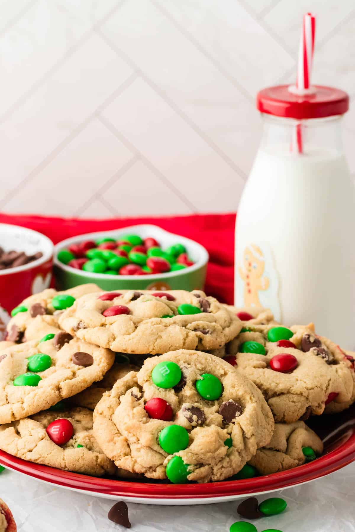 A plate of Christmas cookies and milk.