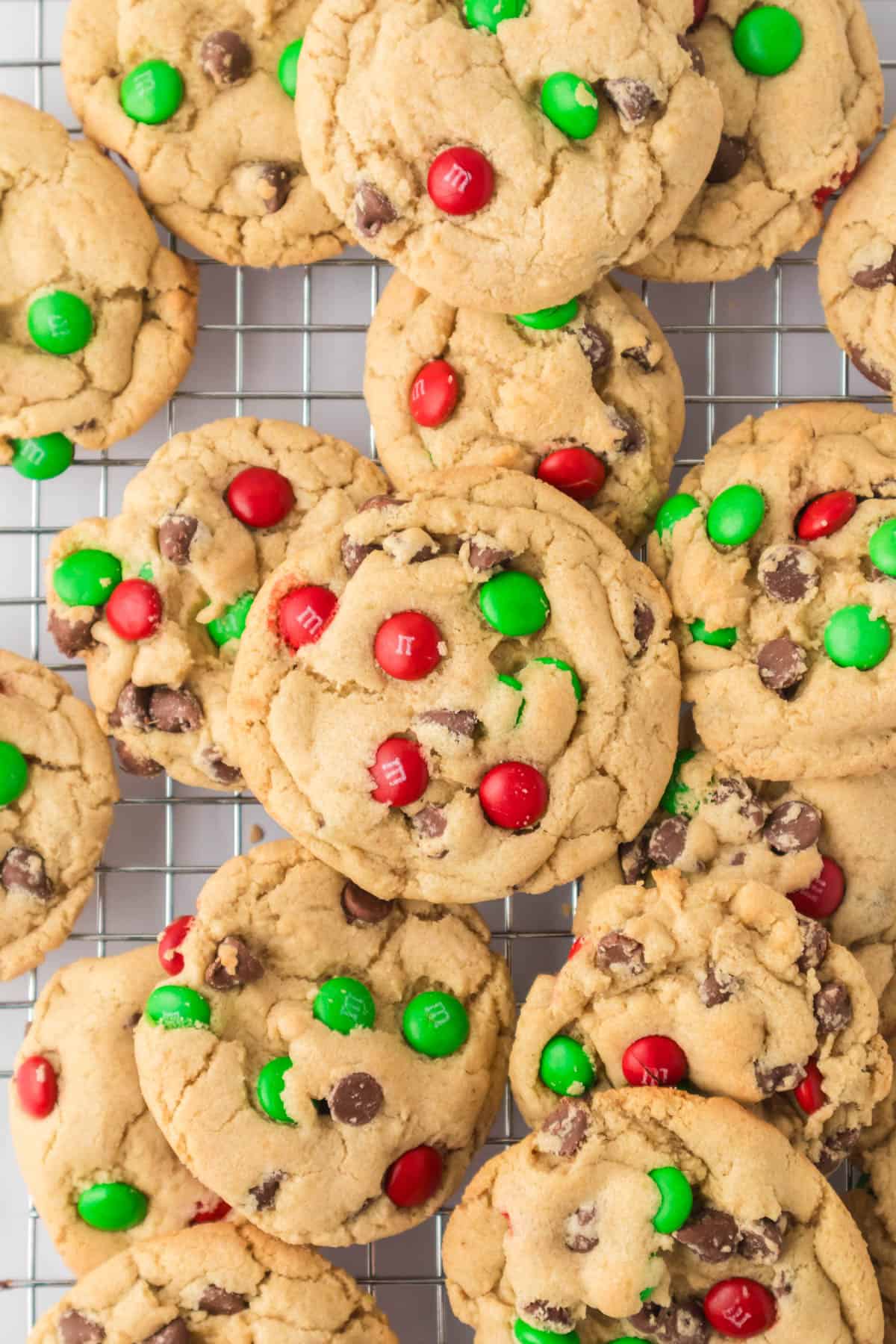 An overhead image of M&M cookies with Christmas M&Ms.