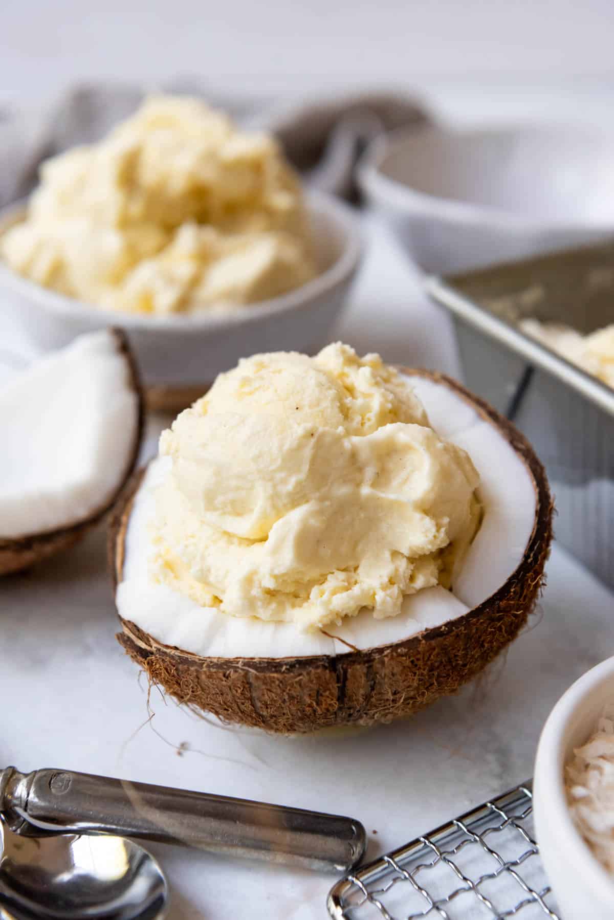 Homemade coconut ice cream in half a coconut as a bowl.