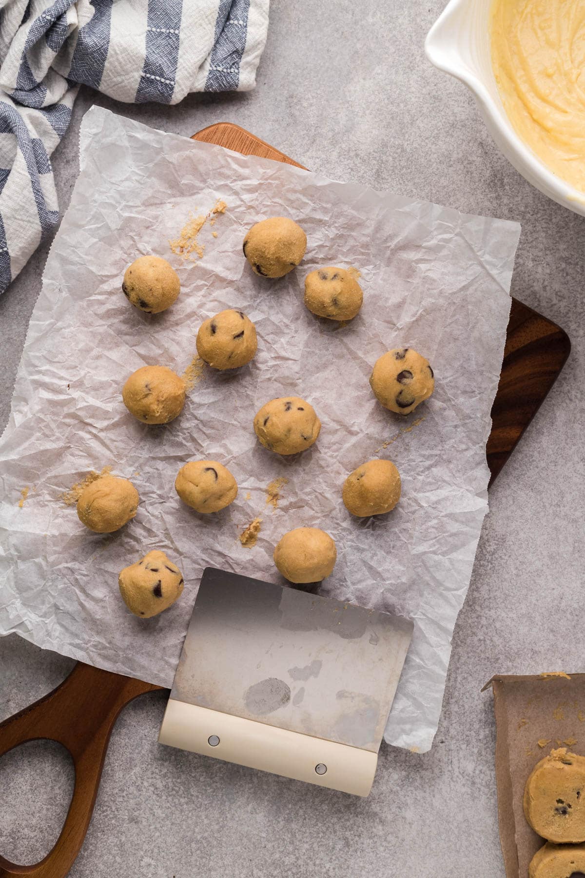 Rolled balls of chocolate chip cookie dough.