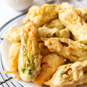 An image of fried squash blossoms stuffed with goat cheese.