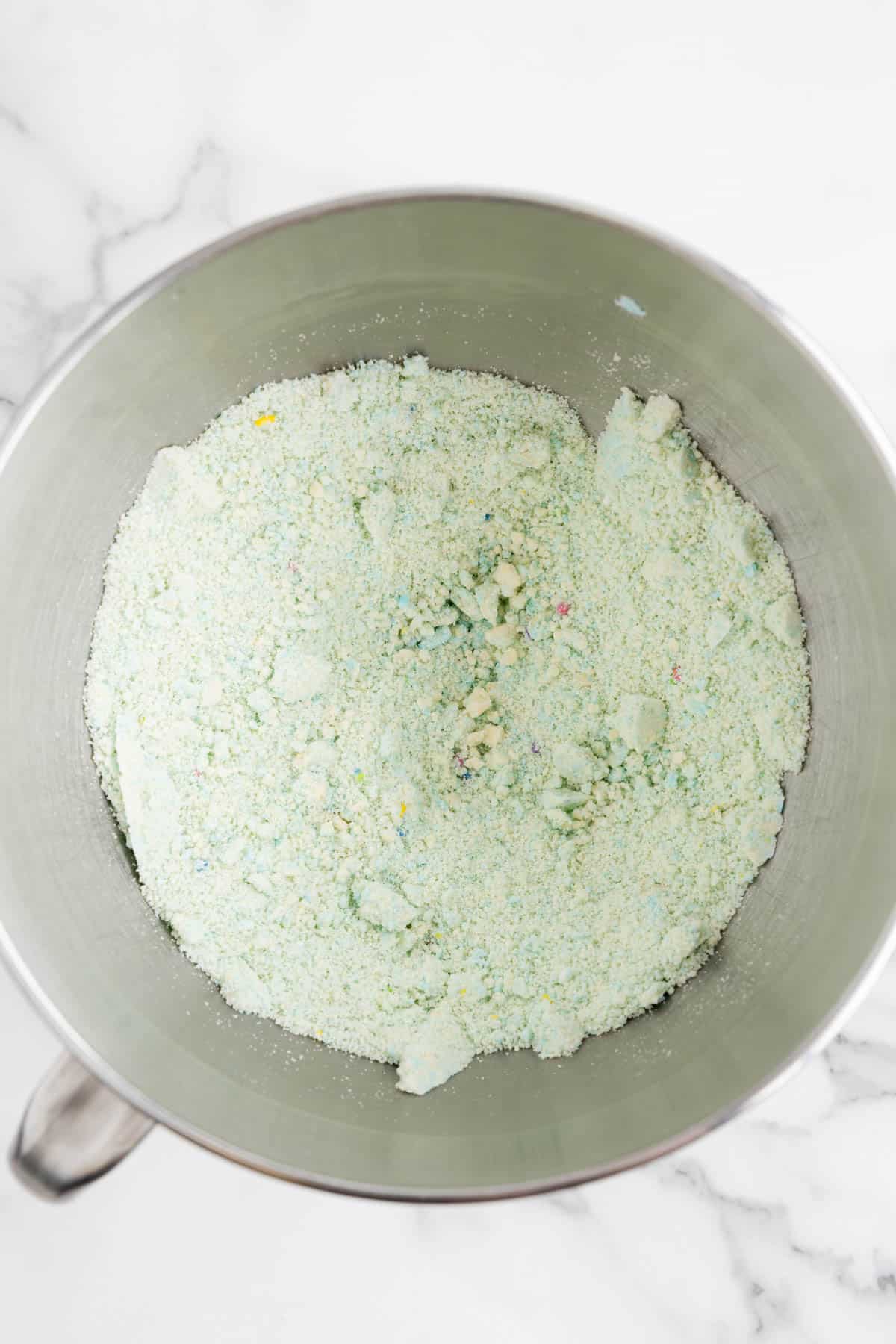 Crumbled up Lofthouse cookies in a mixing bowl.