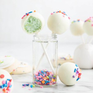 An image of cookie cake pops sticking out of a jar.