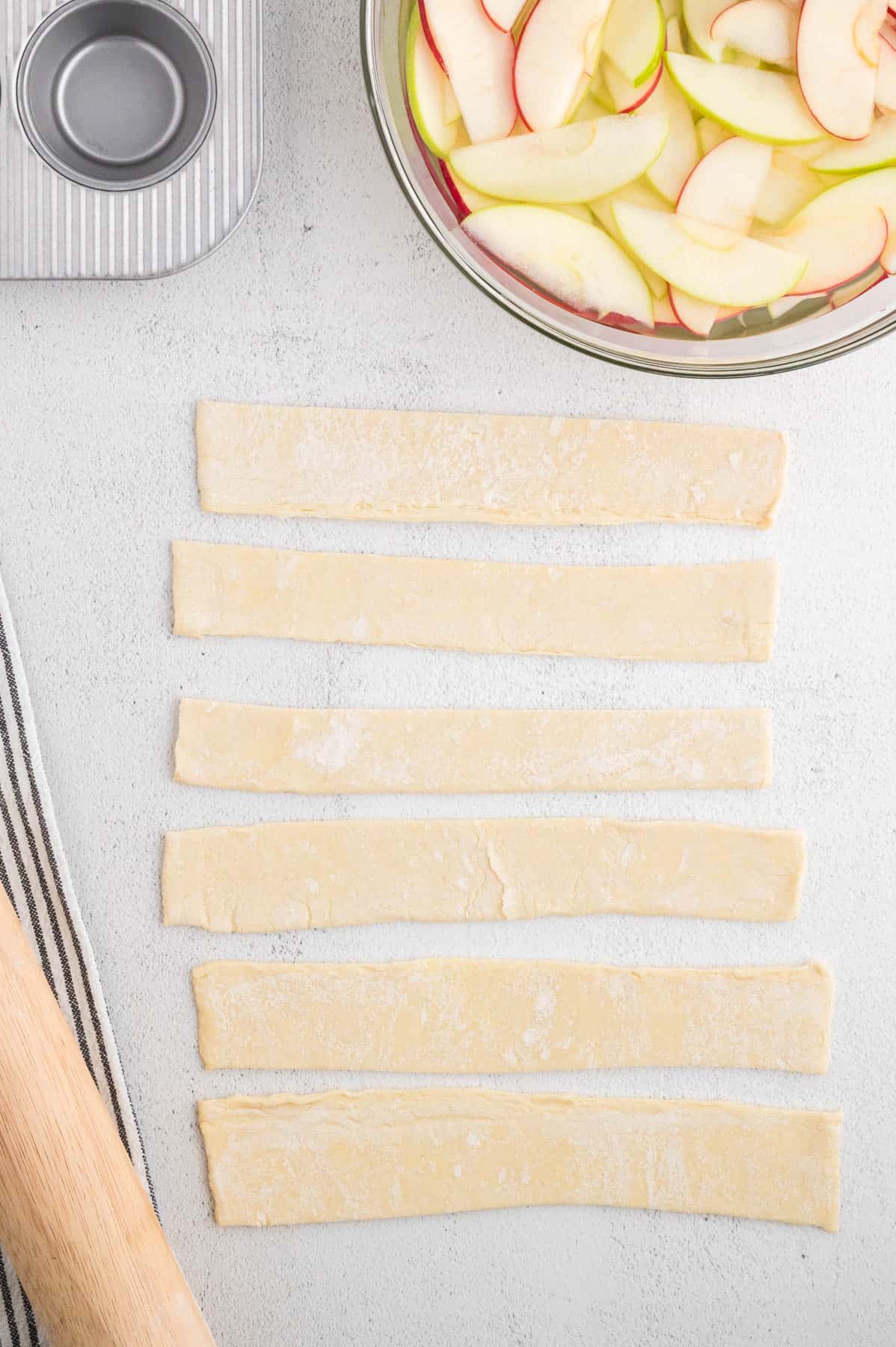 Strips of puff pastry dough.