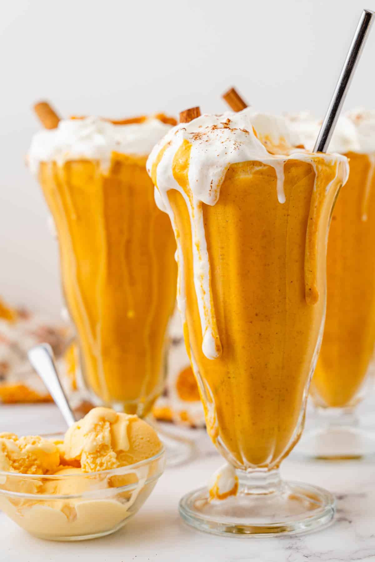 A close image of pumpkin pie milkshakes.