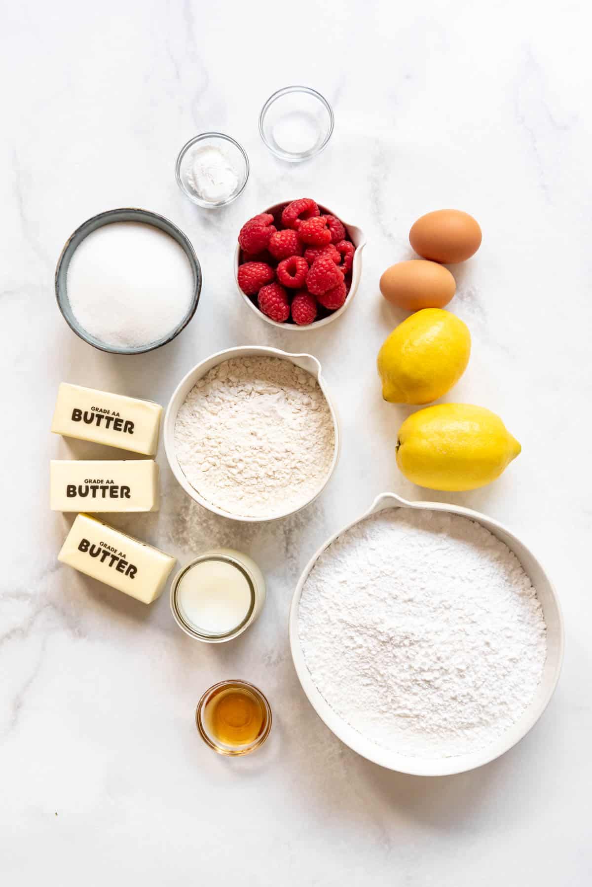 Top view of ingredients needed to make Raspberry Lemonade Cupcakes with raspberry buttercream frosting.
