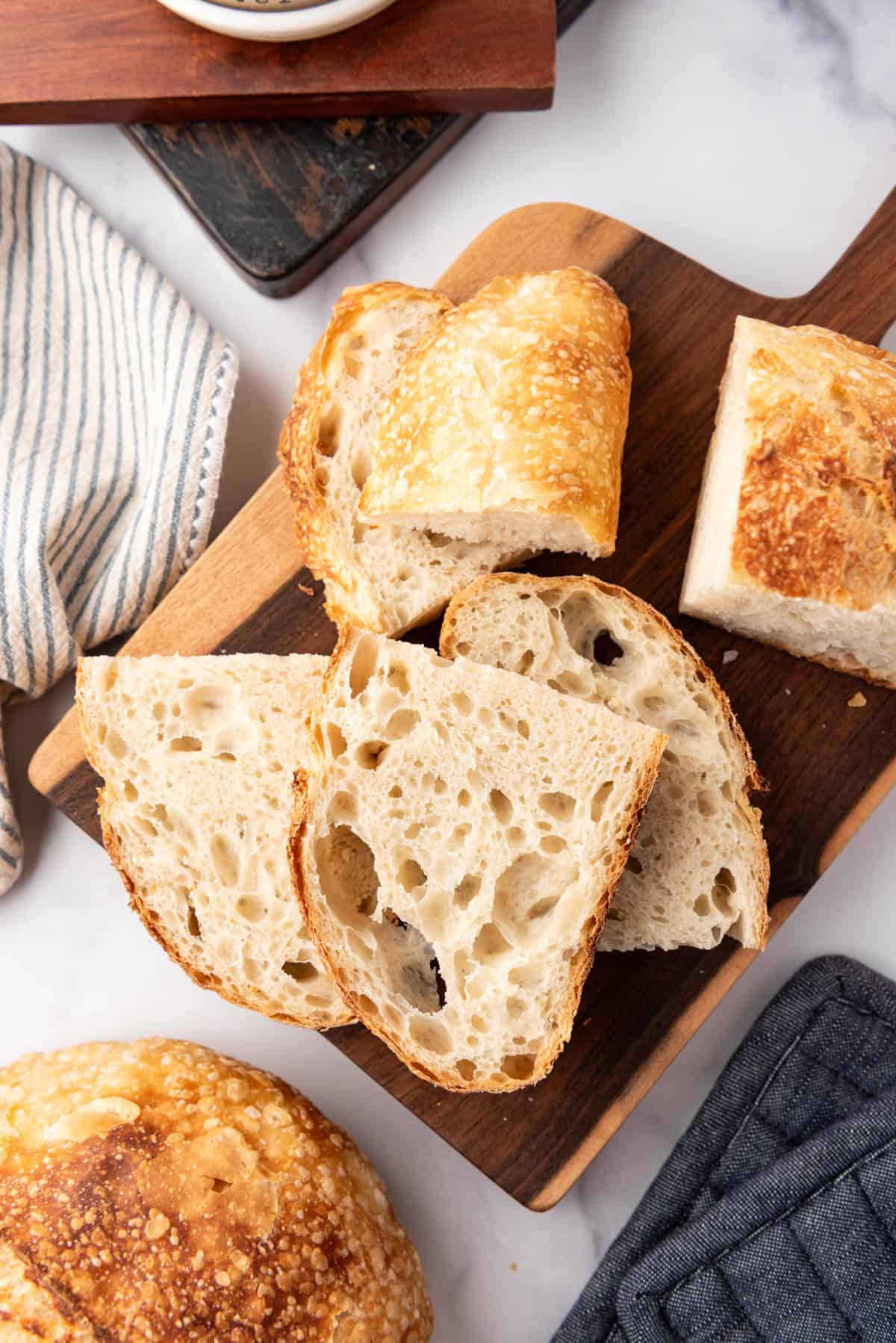 An overhead image of slices of homemade sourdough bread.