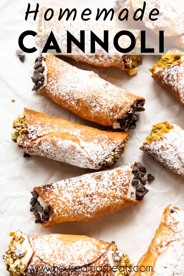 An overhead image of homemade cannoli dusted with powdered sugar with text overlay.