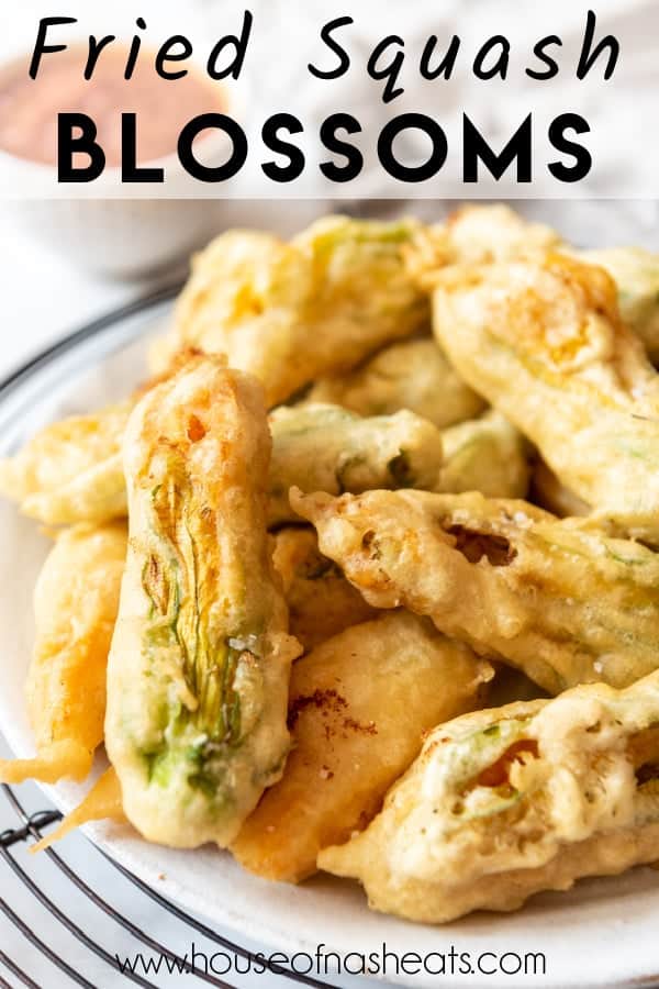 Fried squash blossoms on a plate with text overlay.