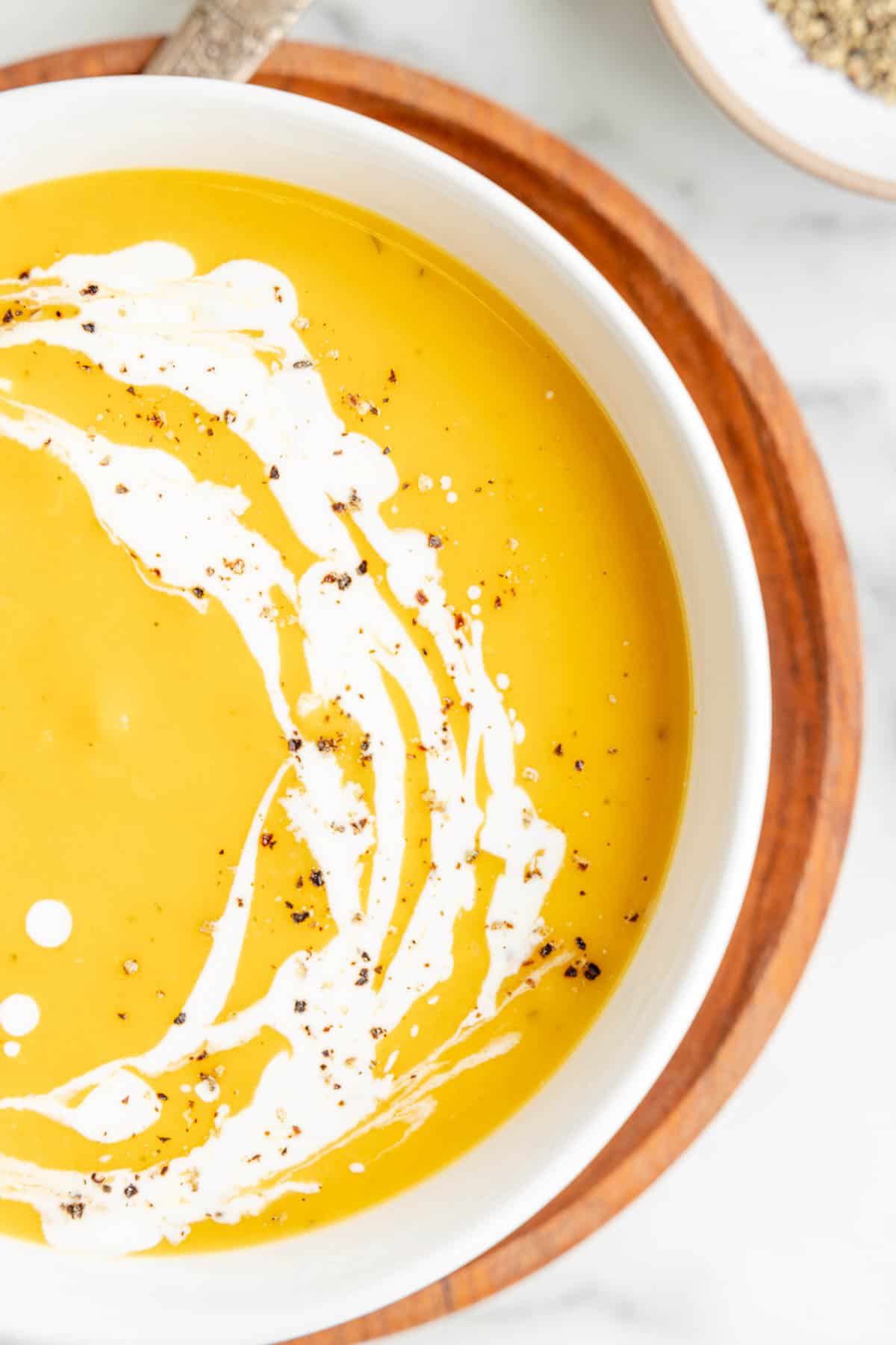 A close overhead image of butternut squash soup in a bowl.