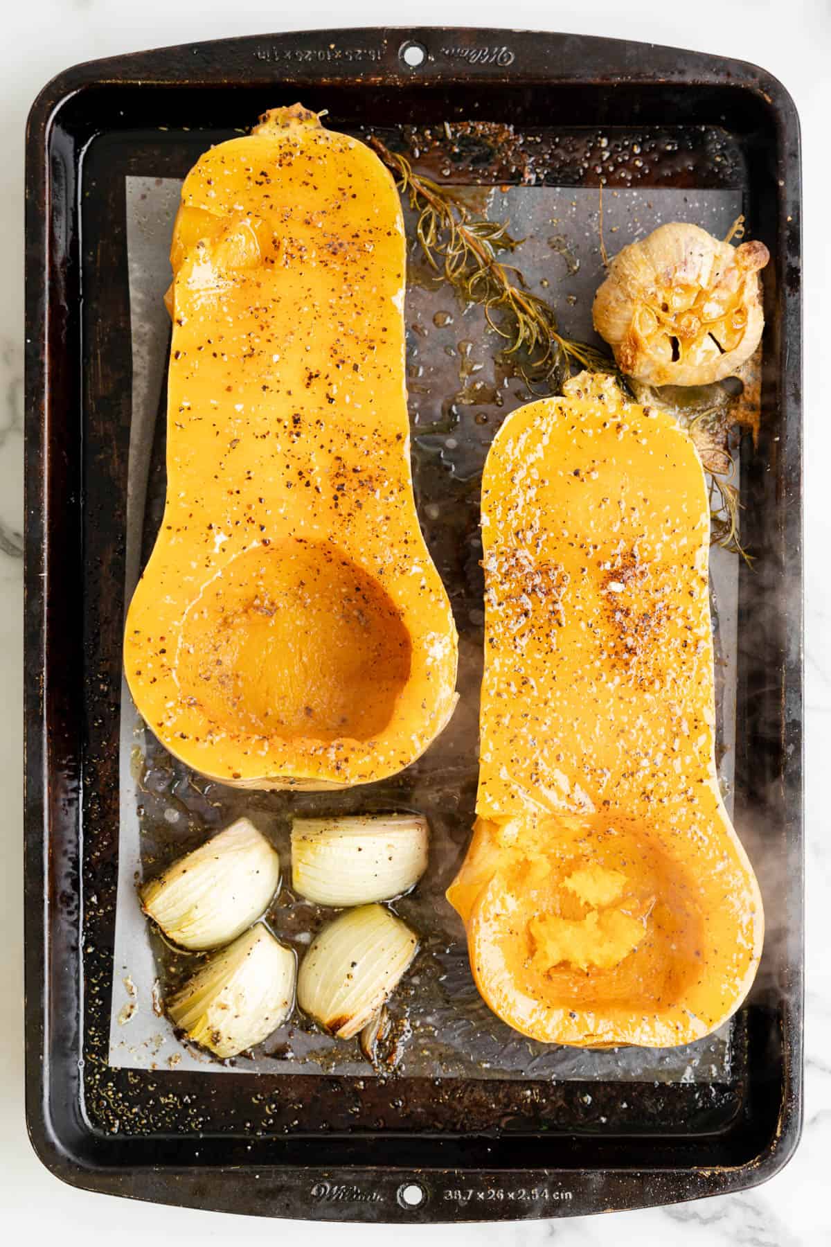 Roasted butternut squash on a pan.