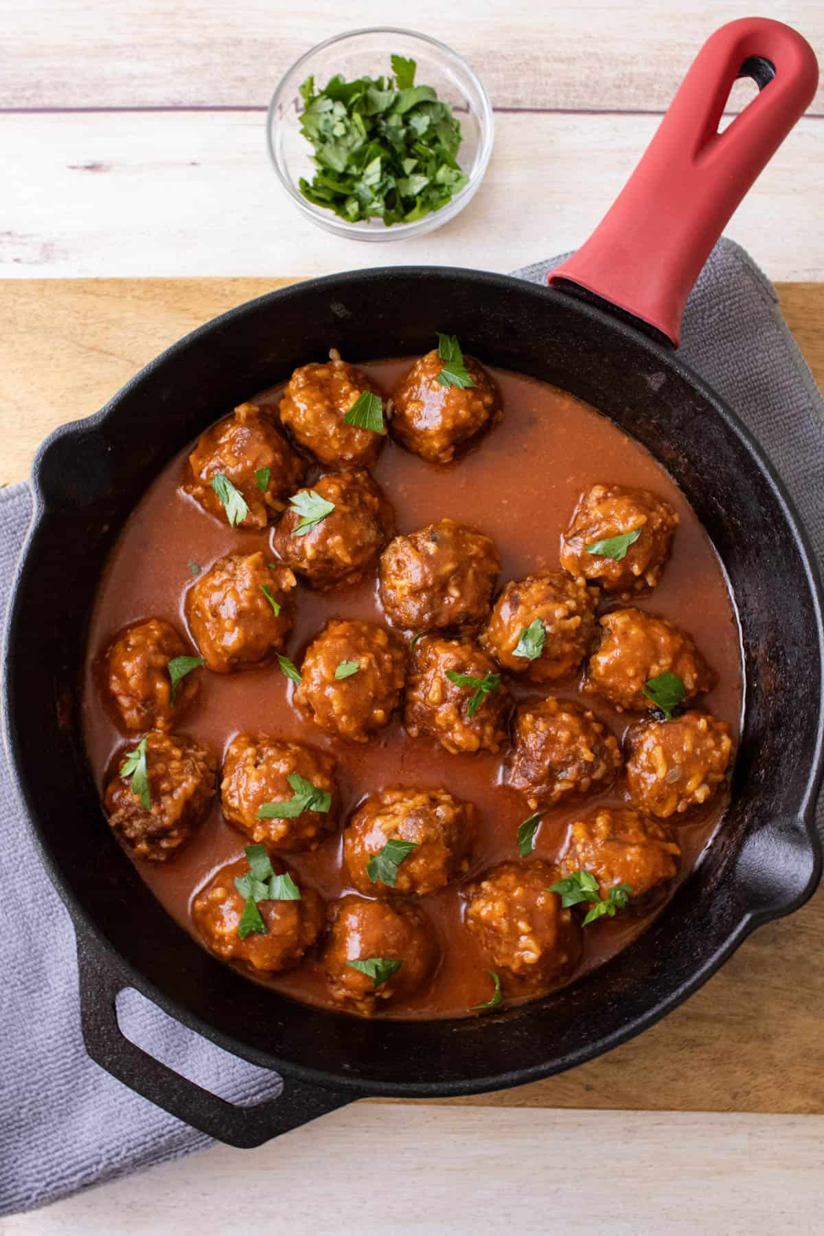 An overhead image of a pan of porcupine meatballs.