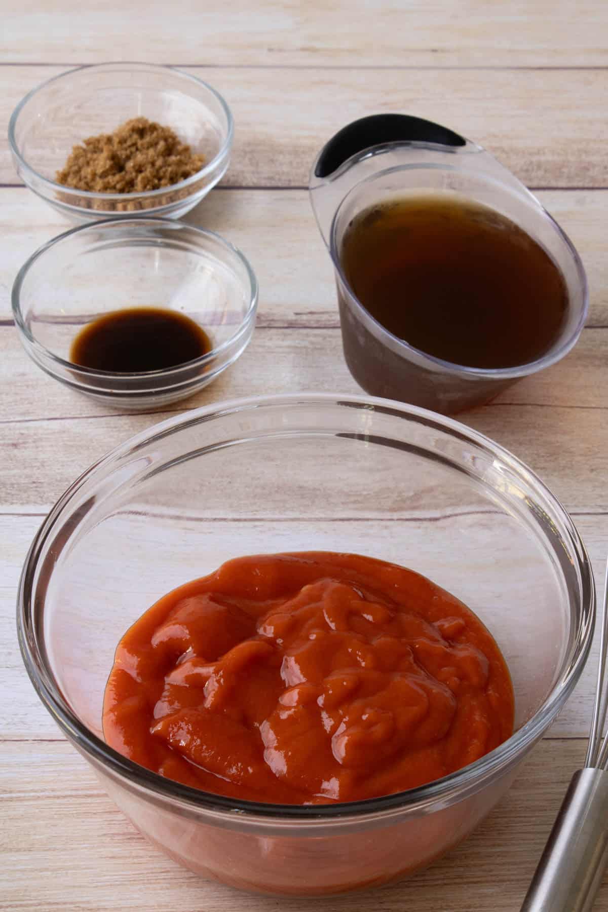 Combining sauce ingredients.