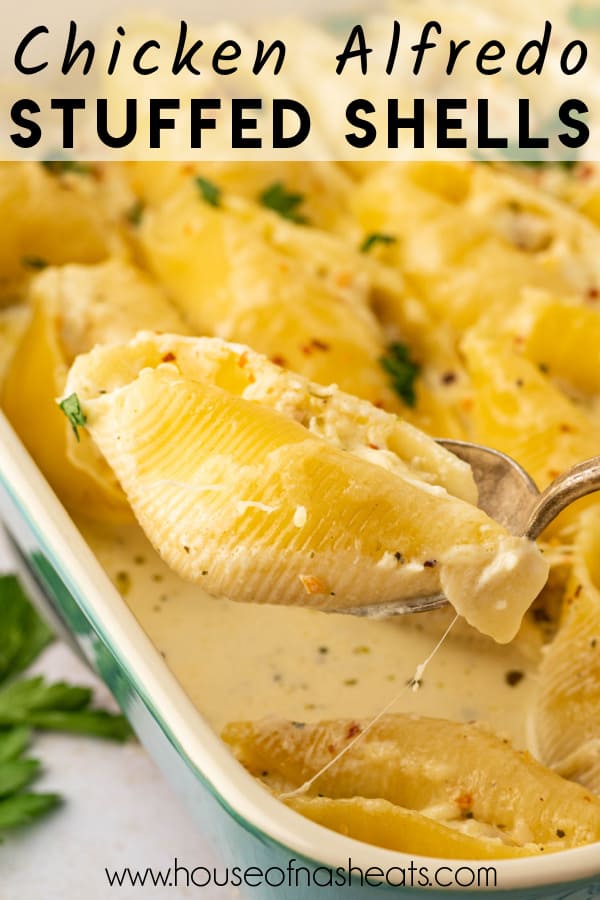 A spoon lifting a chicken alfredo stuffed shell with text overlay.