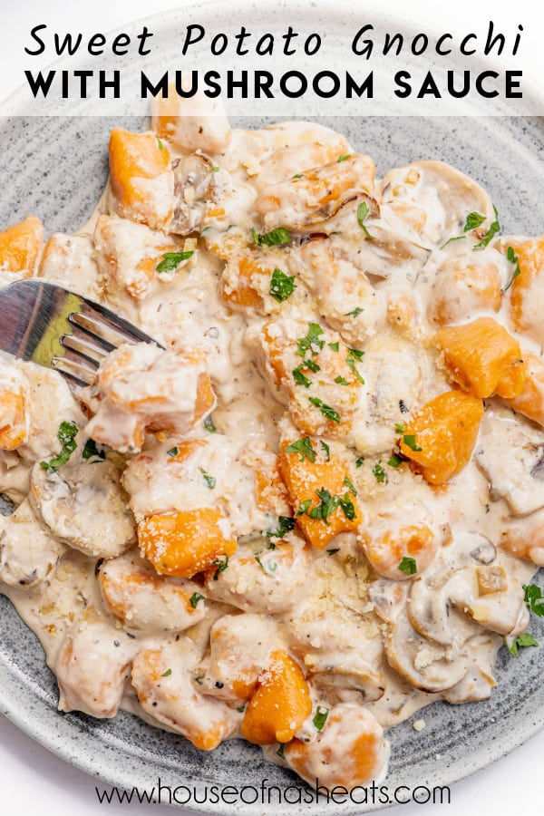 A plate of sweet potato gnocchi in a garlic cream mushroom sauce with text overlay.