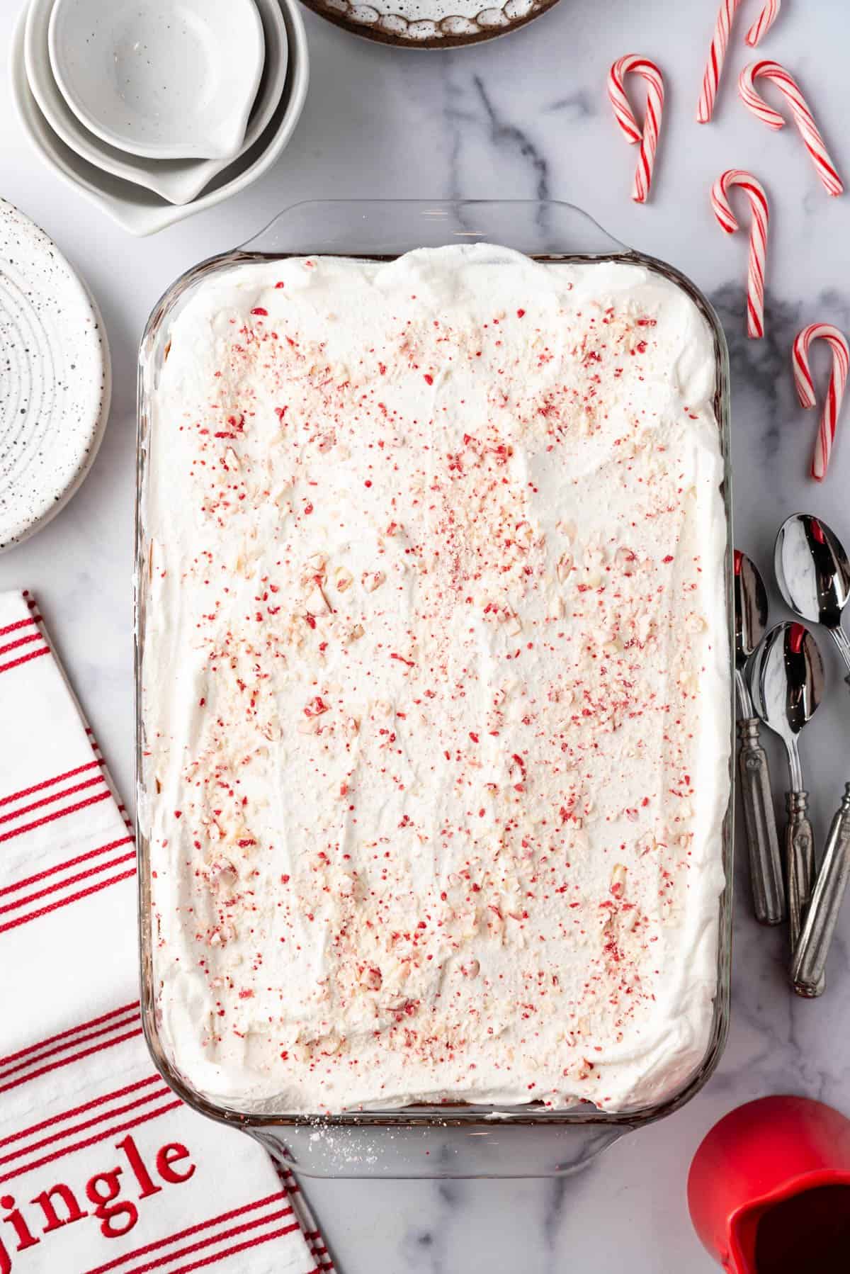 A finished chocolate peppermint lasagna with more chopped candy cane kisses sprinkled on top.